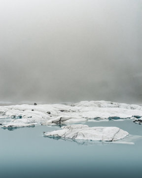 Small glaciers floating in the alpine lake.