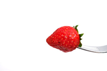 Isolated picture of fresh red strawberry on silver fork and space for write wording, sweet delicious meaningful fruit for love specially in valentines day, high vitamins fruit good for kids and adult