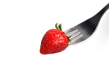 healthy Strawberry impale with stanley fork on white isolated background