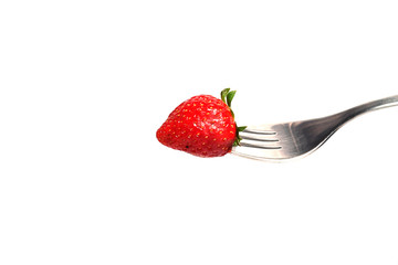 healthy Strawberry impale with stanley fork on white isolated background
