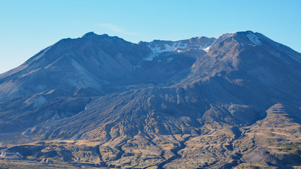 Mount Saint Helens in Washington State as seen from the Johnstin Ridge Observatory Boundary Trail on a clear, cloudless autumn morning.