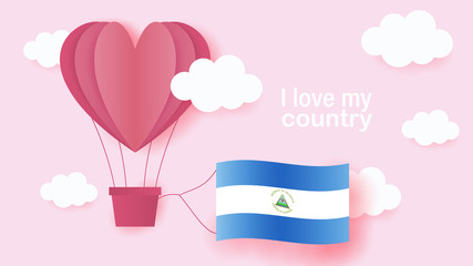 Hot air balloons in shape of heart flying in clouds with national flag of Nicaragua. Paper art and cut, origami style with love to Nicaragua