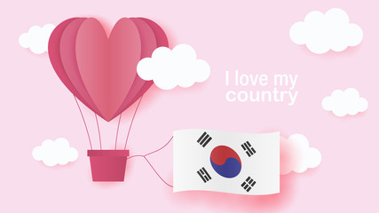 Hot air balloons in shape of heart flying in clouds with national flag of South Korea. Paper art and cut, origami style with love to South Korea