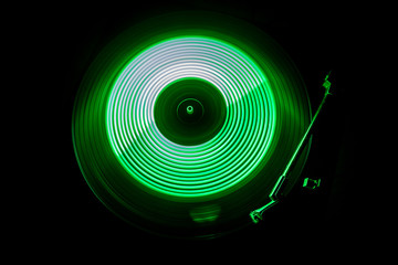 Concept of speed - Trail of fire and smoke - Vinyl record. Burning vinyl disk. Turntable vinyl record player. Retro audio equipment for disc jockey. Sound technology