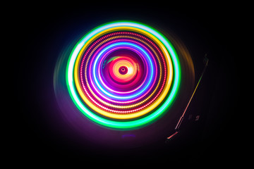 Concept of speed - Trail of fire and smoke - Vinyl record. Burning vinyl disk. Turntable vinyl record player. Retro audio equipment for disc jockey. Sound technology