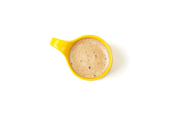 Yellow mug of coffee isolated on white background, top view