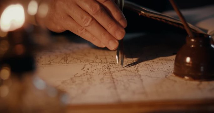 Different views of a vintage 1850 mapmaker using a compass divider going over a map taking notes