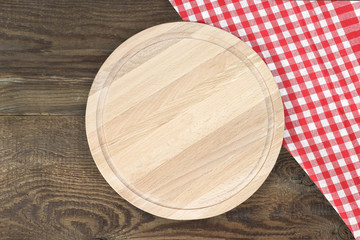 Cutting board or chopping board on wooden table.