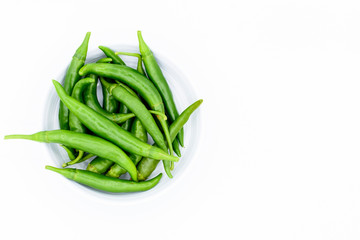 green chilies in bowl isolated on white background