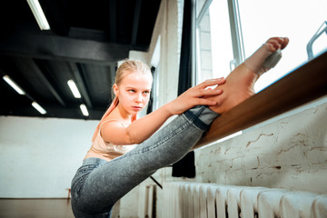 Beautiful blond teenager from generation z looking focused