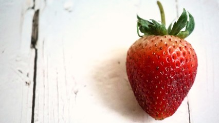 Fresh strawberry on wooden table.