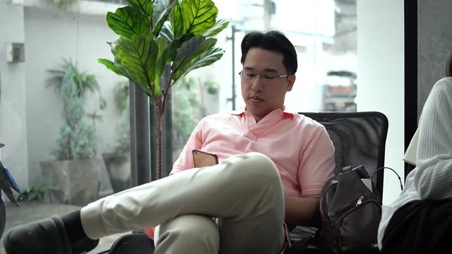 The young man chatting on smartphone