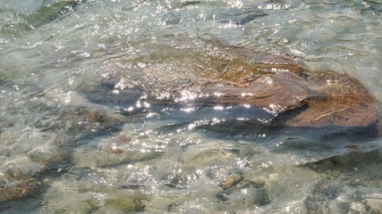 Clear sea water and rock.