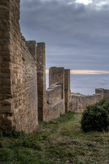 Fototapeta na wymiar Winter view of medieval partially restored Romanesque Loarre castle near Huesca in Aragon region Spain with round towers, donjon, on top of a high rock