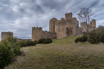 Winter view of medieval partially restored Romanesque Loarre castle near Huesca in Aragon region Spain with round towers, donjon, on top of a high rock