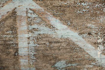 old gray wooden board with cracks and peeling blue white paint. natural rough surface texture