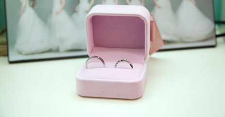 Obraz na płótnie Canvas a pair of wedding rings placed in a box
