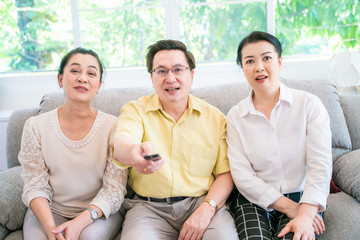 Friend group of senior retirement enjoying watch television