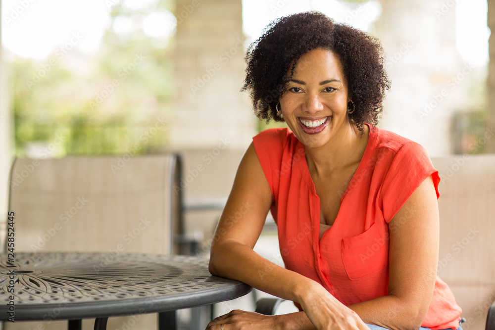 Wall mural confident happy african american woman smiling outside