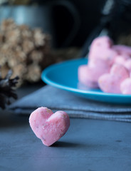 Kleeb Lamduan,Thai shortbread cookies heart shape in blue plate on black background for love issue.