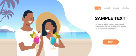 couple drinking exotic tropical cocktails on sea beach summer vacation concept african man woman having fun seascape background seaside horizontal portrait copy space
