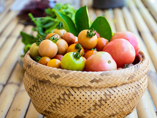 tomatos in basket and fresh vetgetable for cooking