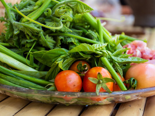 tomatos in basket and fresh vetgetable for cooking