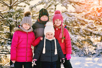 Children friends on a winter walk. Group of children on a winter day