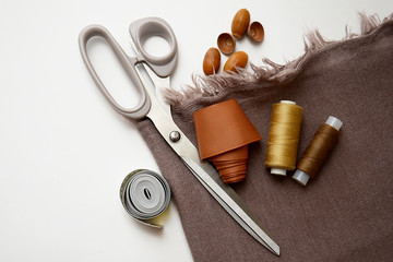 sewing kit fabric and accessories on a light background