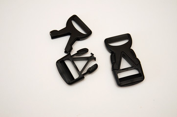 three-point black fastex lies on a white background