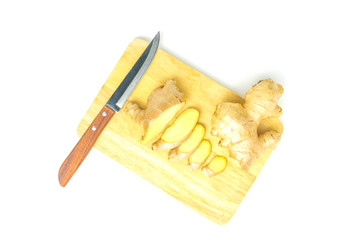 Ginger fresh isolated on chopping board and a knife in white background and clipping path. The name of science : Zingiber officinale Roscoe