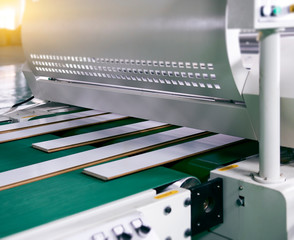 Large factory machinery for wood flooring is being automated