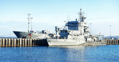 Moored military ships on a pier in Kiel