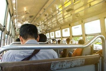 Inside the bus old of Thailand Bangkok in morning in rush hour. there are middle-aged man and...