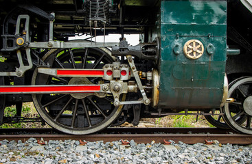 Focus detail Wheel Mechanism of the train old Steam locomotive of Japanese World War II at Thailand.