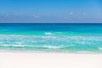 Fototapeta na wymiar Beautiful sandy beach with turquoise sea. Tropical beach background.