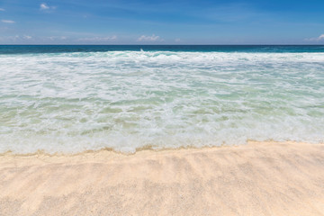 Fototapeta na wymiar Sandy beach with turquoise sea. Tropical beach background.
