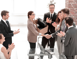 business team welcomes the new employee with applause