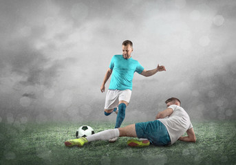 Fototapeta na wymiar Soccer player on a football field in dynamic action 