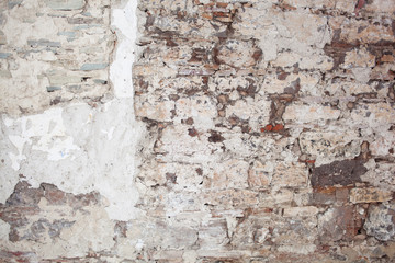 old medieval plaster and brick wall in shadow