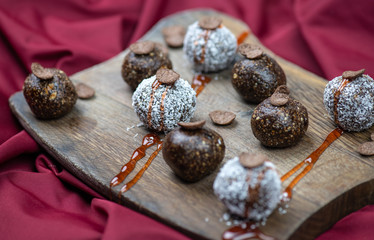 Healthy raw energy balls with cocoa, coconut, nuts