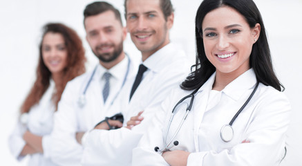 Fototapeta premium woman doctor on the background of colleagues