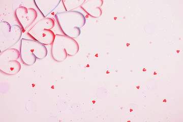 Valentine's day greeting card with beautiful pure pink hearts and confetti. Lovely Happy Valentine's day minimal concept. top view, flat lay.