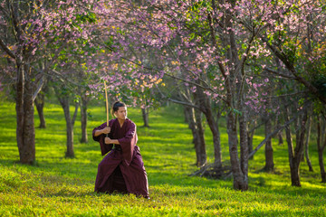 The Japanese samurai are gripping the sword, preparing to fight.