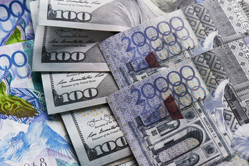 Fototapeta na wymiar Dollars and tenge. American and Kazakh money close up