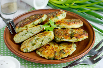 Cottage cheese pancakes or syrniki with herbs green onion and parsley