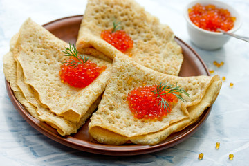 Delicious pancakes with red caviar