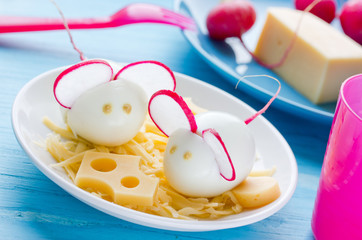 Fun food for kids - hard boiled egg mice snack with cheese
