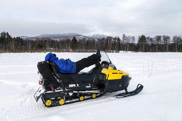 Athlete on a snowmobile.