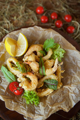 Shrimp, squid rings and other seafood deep-fried in batter.